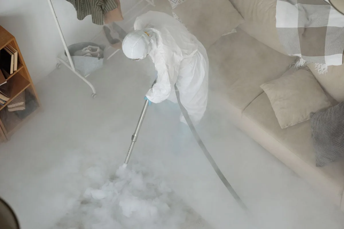 Biohazard cleanup technician in protective equipment, Beulah, ND